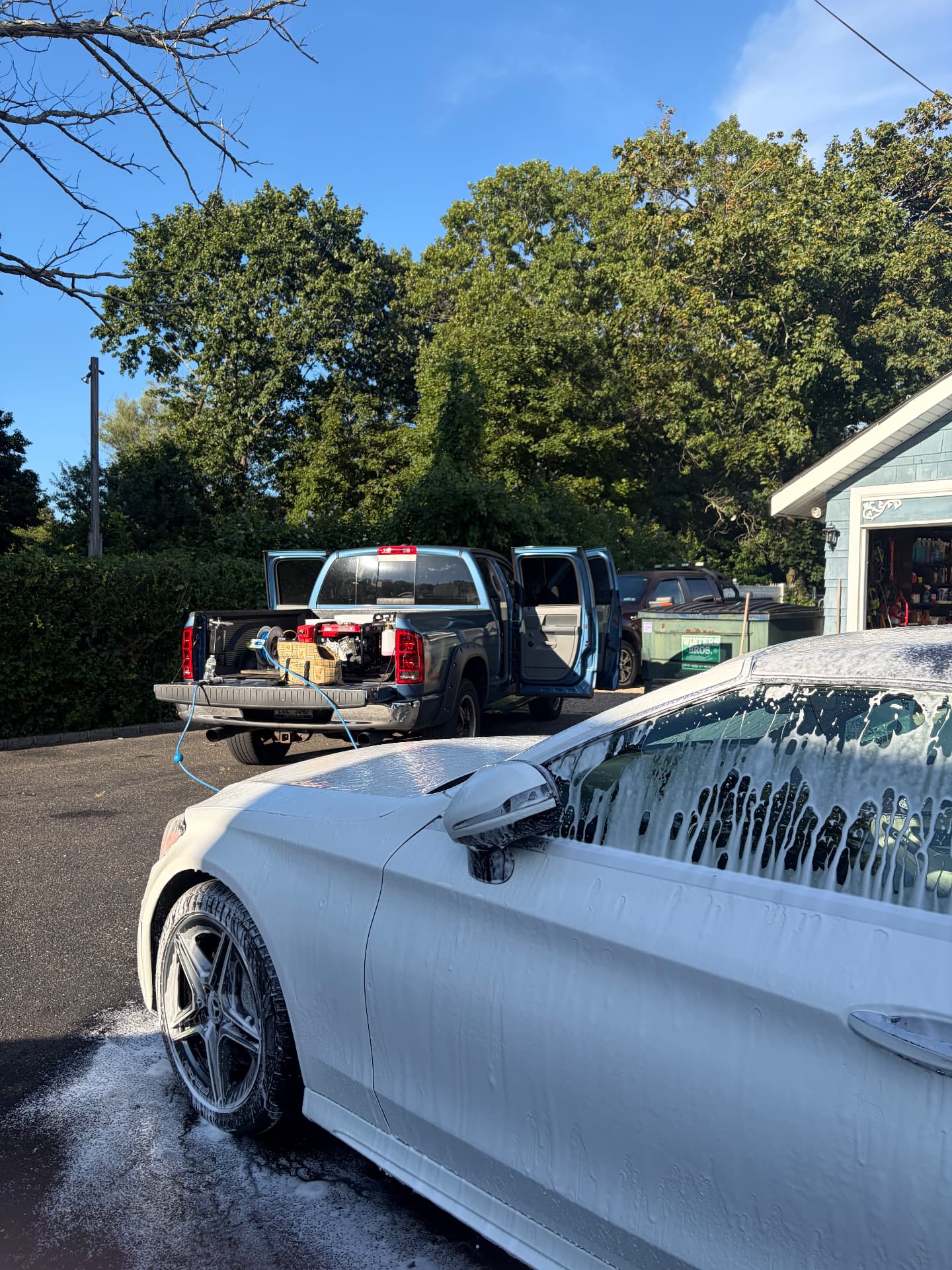 Focus Detailing truck with onboard generator and water tank set up in a Long Island driveway